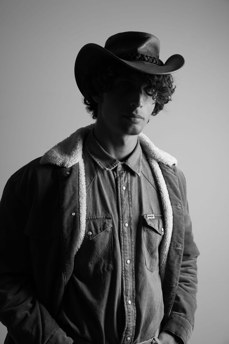 Western hat portrait, low key
