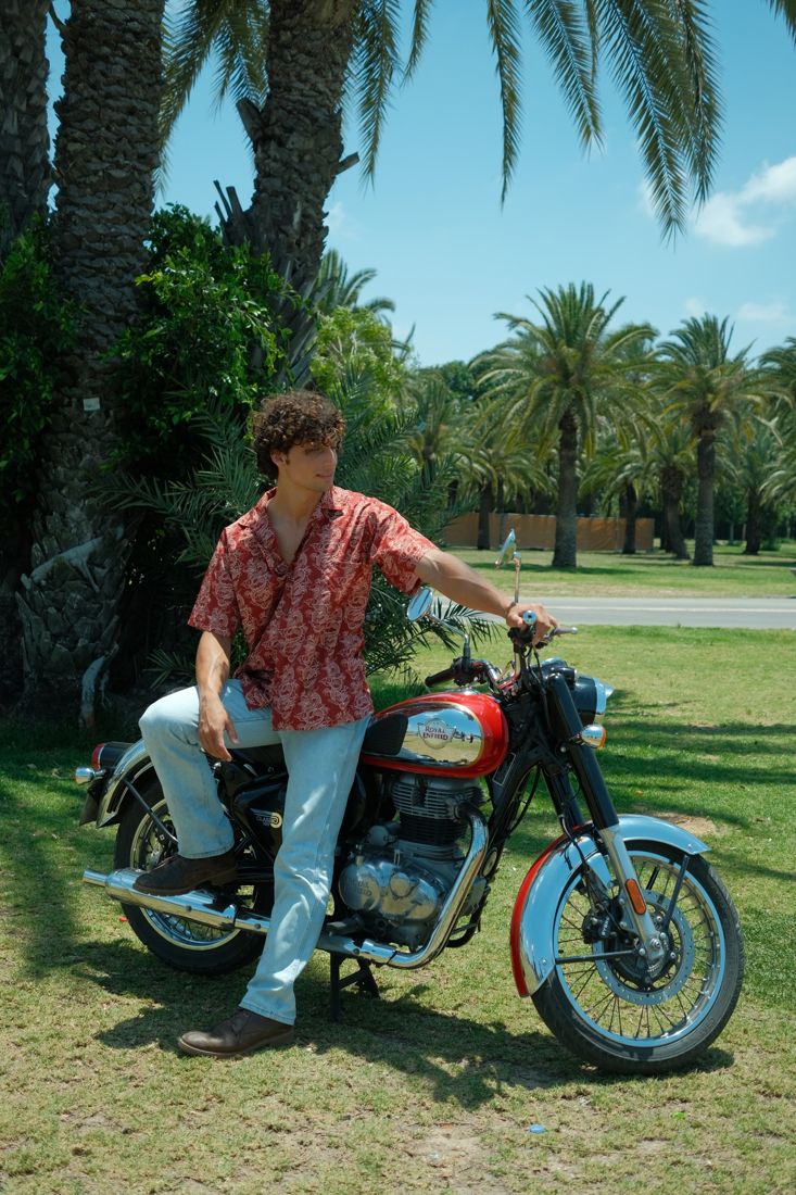 Royal Enfield motorcycle, palm trees